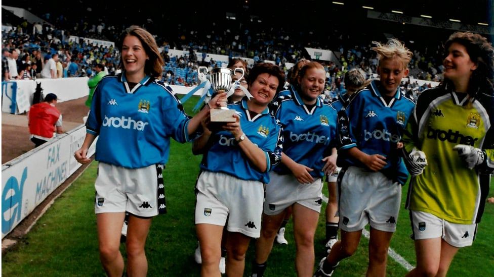 SHOWING OFF THE SILVERWARE : Parading our trophy around the Maine Road pitch