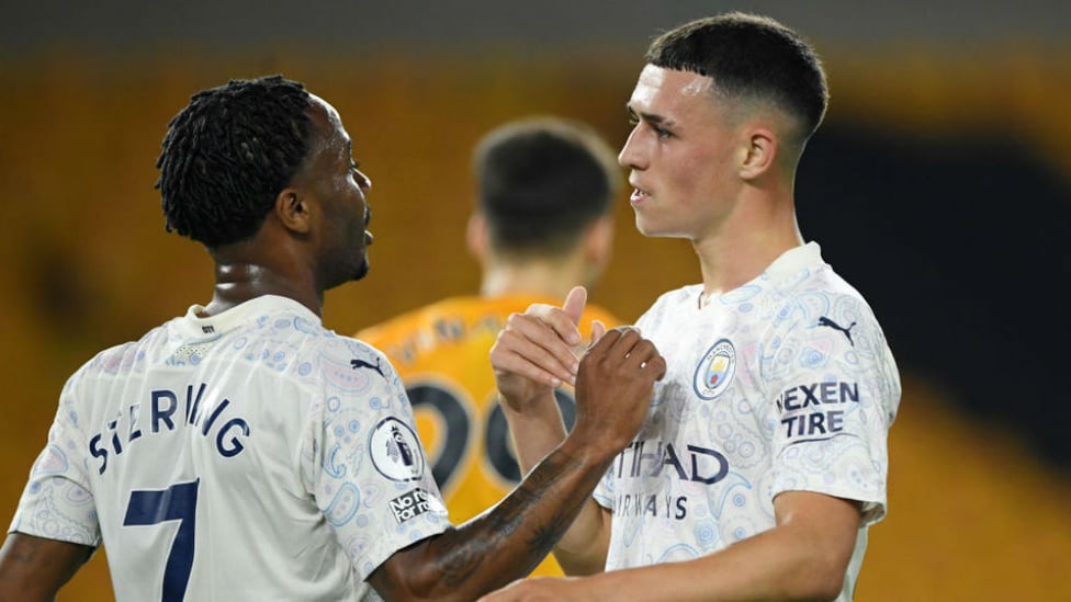DOUBLE DELIGHT: Phil Foden is congratulated by Raheem Sterling after City's superb second goal