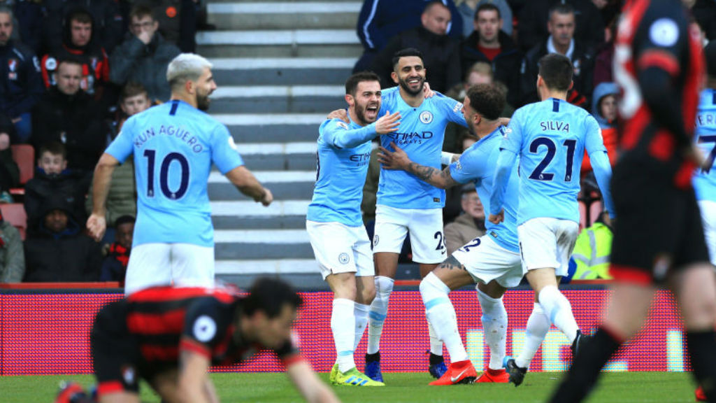 BLUE HEAVEN: Riyad Mahrez celebrates with his City team-mates after his crucial goal