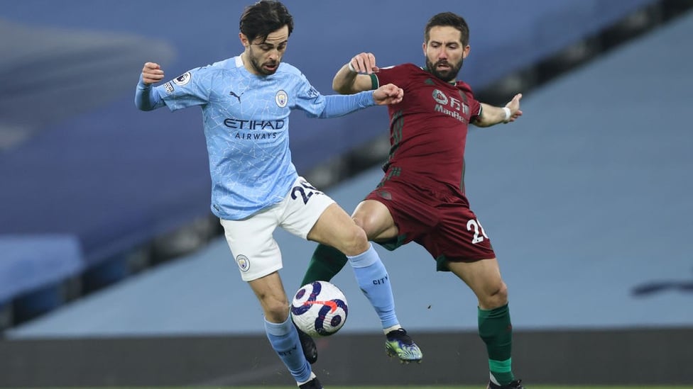 MIDFIELD BATTLE: Bernardo Silva tussles for possession with his fellow countryman Joao Moutinho