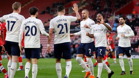 SHARE THE LOVE: The players rush to celebrate the opener with Sterling.