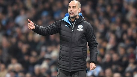 TACTICIAN: Guardiola adjusts his team under the Etihad floodlights.