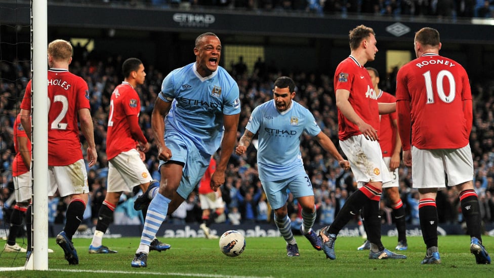 CAPTAIN KOMPANY : The skipper heads City to a 1-0 win against Manchester United in 2012