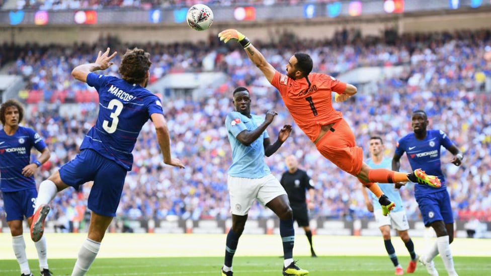 HELPING HAND : Claudio Bravo leaps high to avert the danger from a Chelsea attack