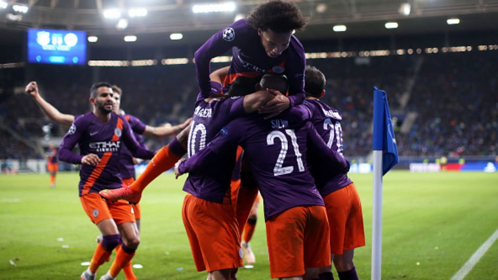 TEAM EFFORT : City celebrate David Silva's late Champions League winner against Hoffenheim