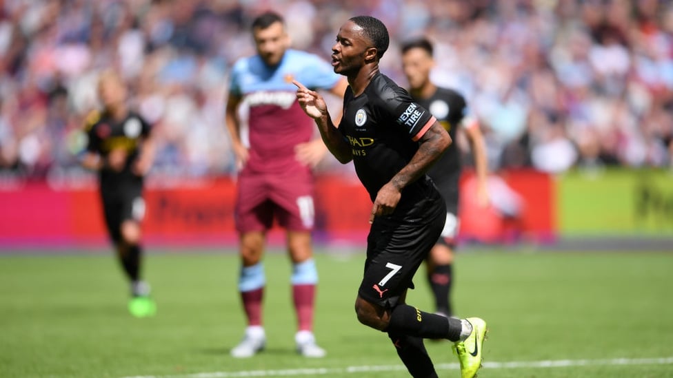 UNSTOPPABLE : Raheem Sterling wheels away after netting his second and City's third.