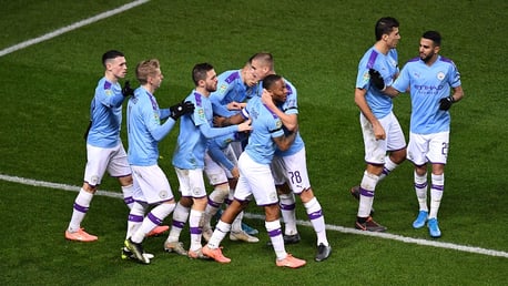 TEAMWORK: Raheem is congratulated on his 17th of the season and City's 100th League Cup goal this decade