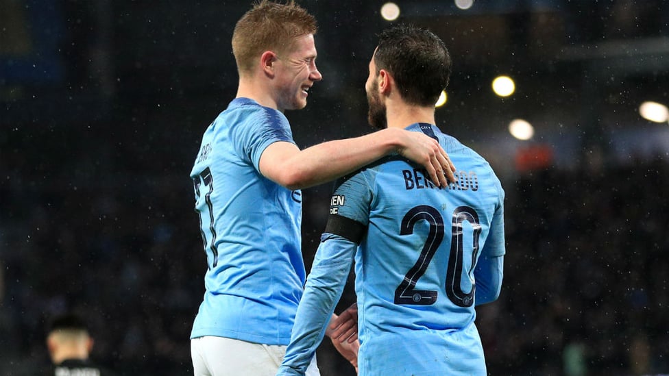 DOUBLE TROUBLE : KDB and Bernardo celebrate City's second.