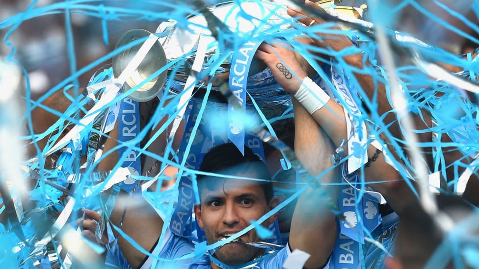 RHAPSODY IN BLUE : Sergio lifts the Premier League trophy after our 2014 title success