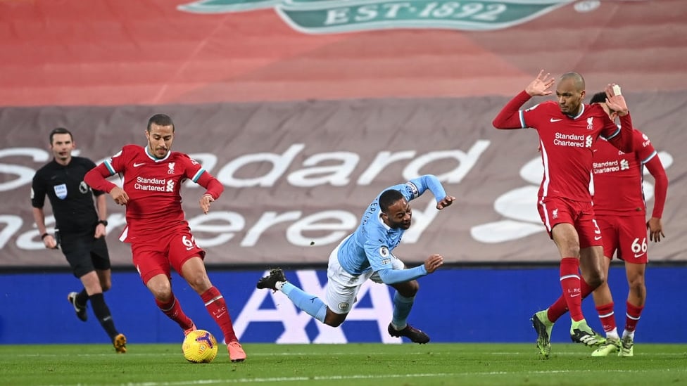 RAZZLE DAZZLE : Sterling is fouled inside the box by Fabinho after some tricky footwork.