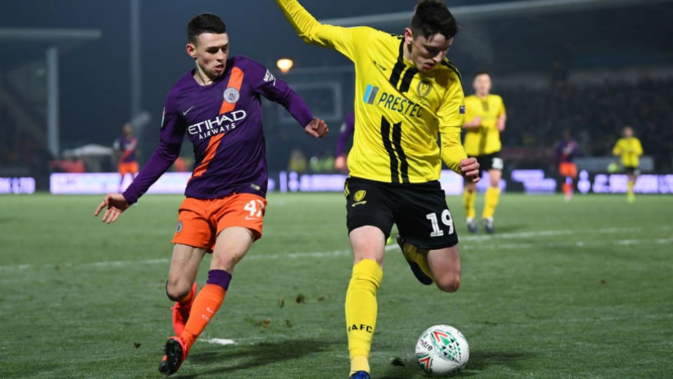 PRESSING HARD : Phil Foden looks to win possession in a dangerous area