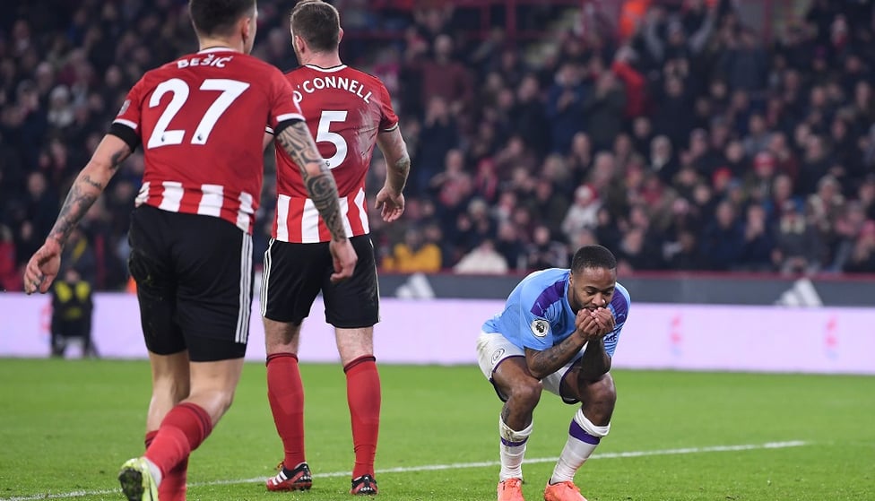 HEAD IN HANDS : Raheem feels he should have scored from Mahrez's pass but is denied by Henderson