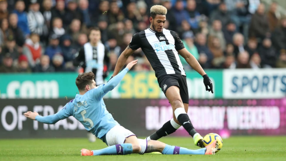 SLIDE AWAY : John Stones straining every sinew to reclaim possession