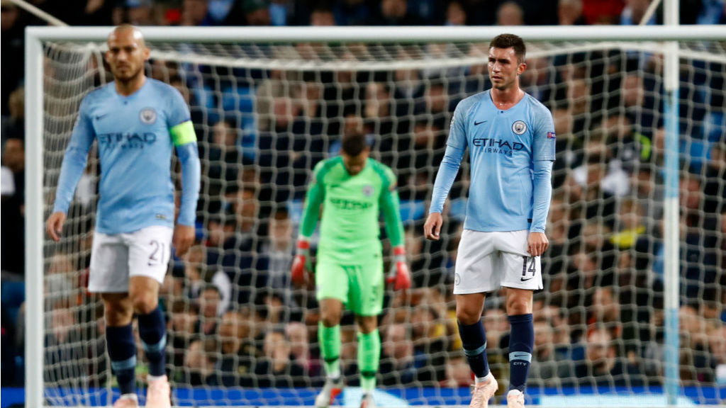 EURO BLOW : The expressions on the City players' faces say it all after Lyon's second goal