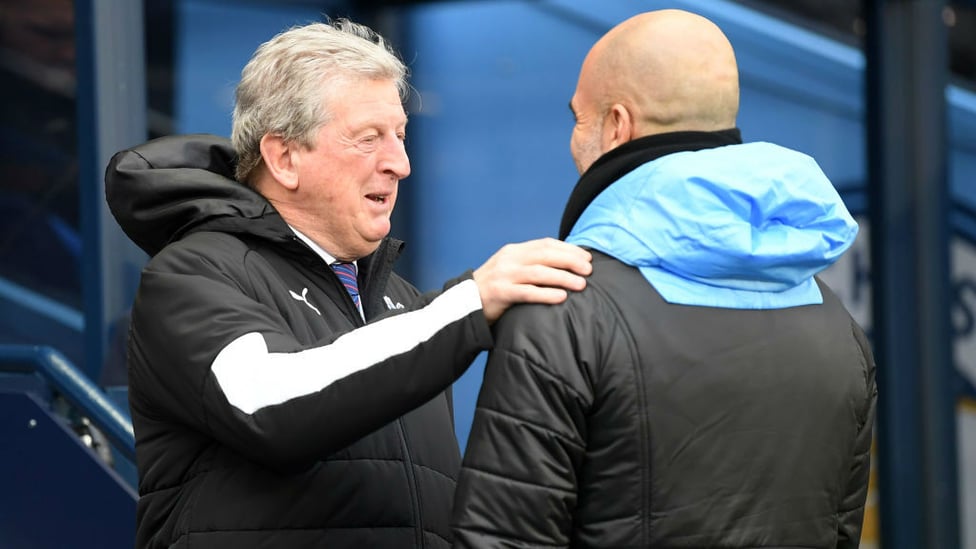 GAFFERS : Guardiola and Hodgson share a warm embrace ahead of kick-off.