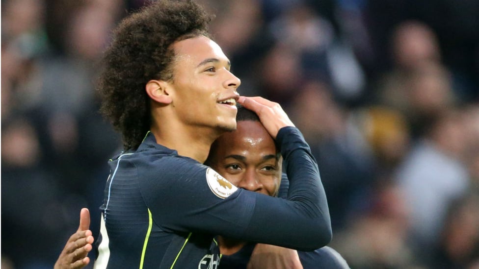 CITY SLICKERS : Leroy Sane and Raheem Sterling celebrate after City's second goal