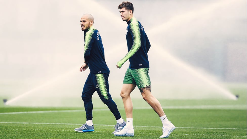 SPLASH HITS : David Silva and John Stones step out with the CFA sprinklers already at work