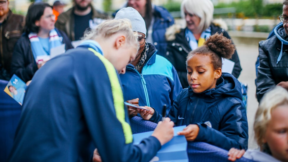 ROLE MODEL : Academy product Esme Morgan signs an autograph for Hannah for City 10s