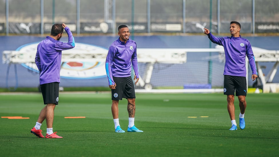 GIFT OF THE GAB : Bernardo Silva and Joao Cancelo share a joke with Gabriel Jesus