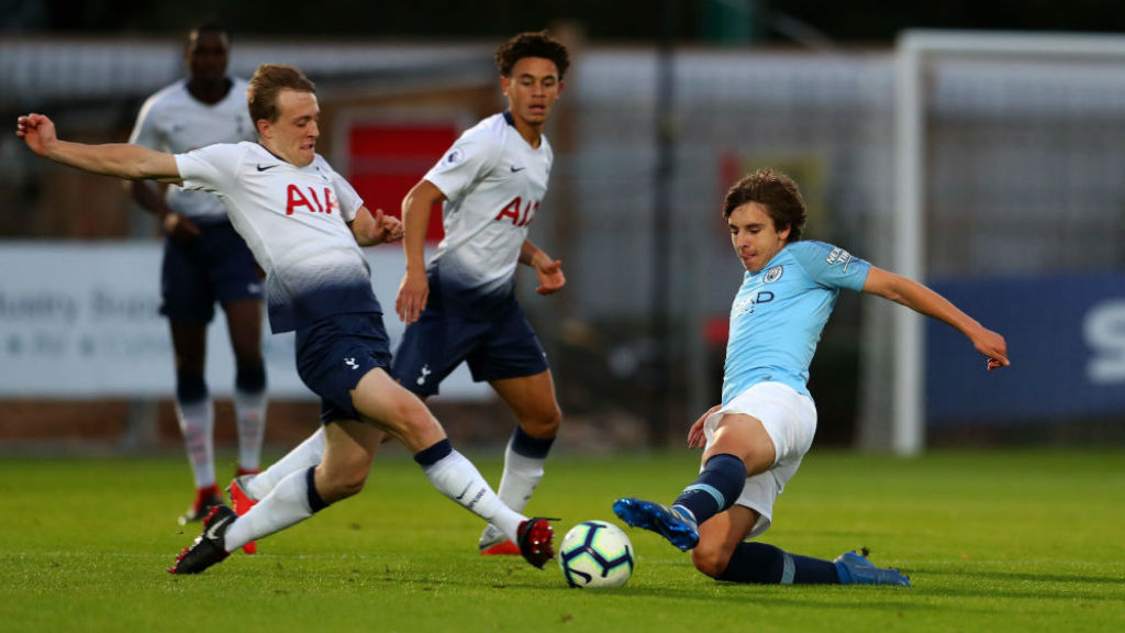 ACTION STATIONS: Adrian Bernabe challenges Tottenham's Oliver Skipp