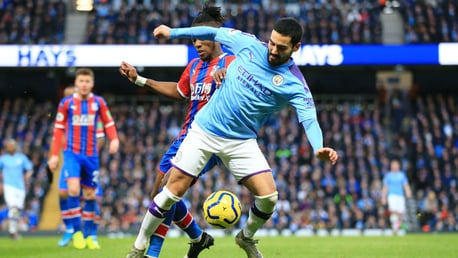 BATTLE: Gundogan tries to evade the attention of Zaha.