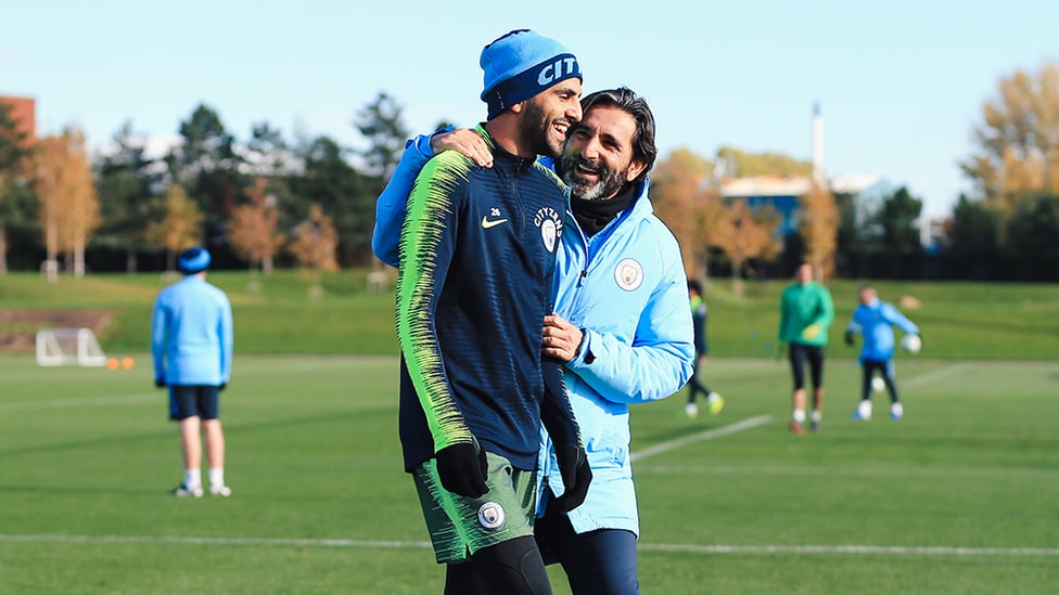 FUN AND GAMES : Fitness coach Lorenzo Buenaventura shares a smile with Riyad Mahrez