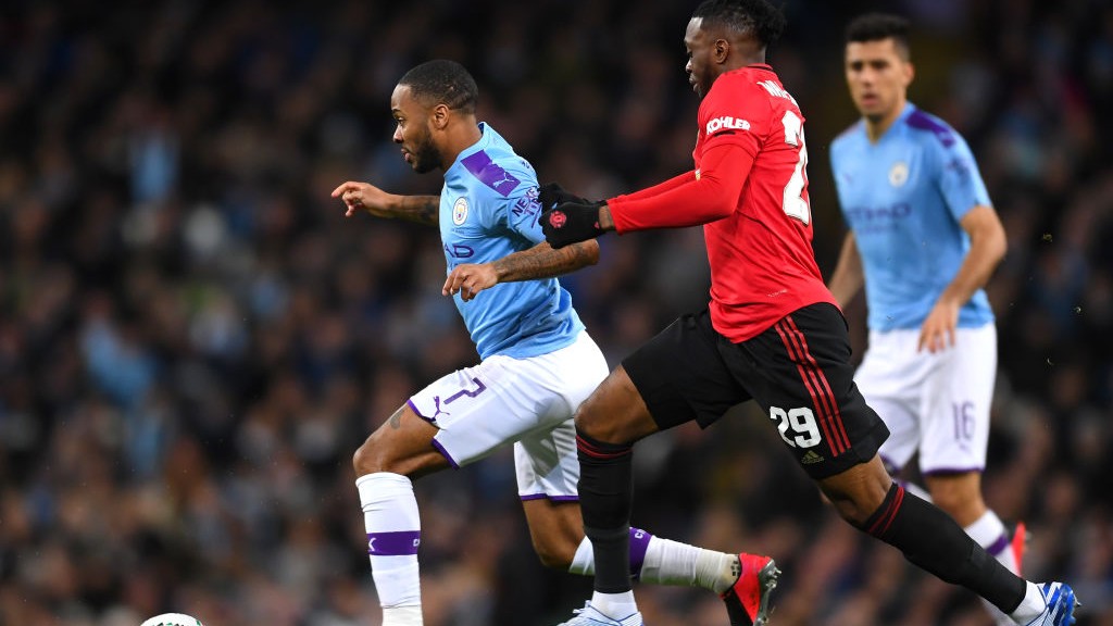 ACTION : _Sterling looks to escape the attention of Wan-Bissaka_