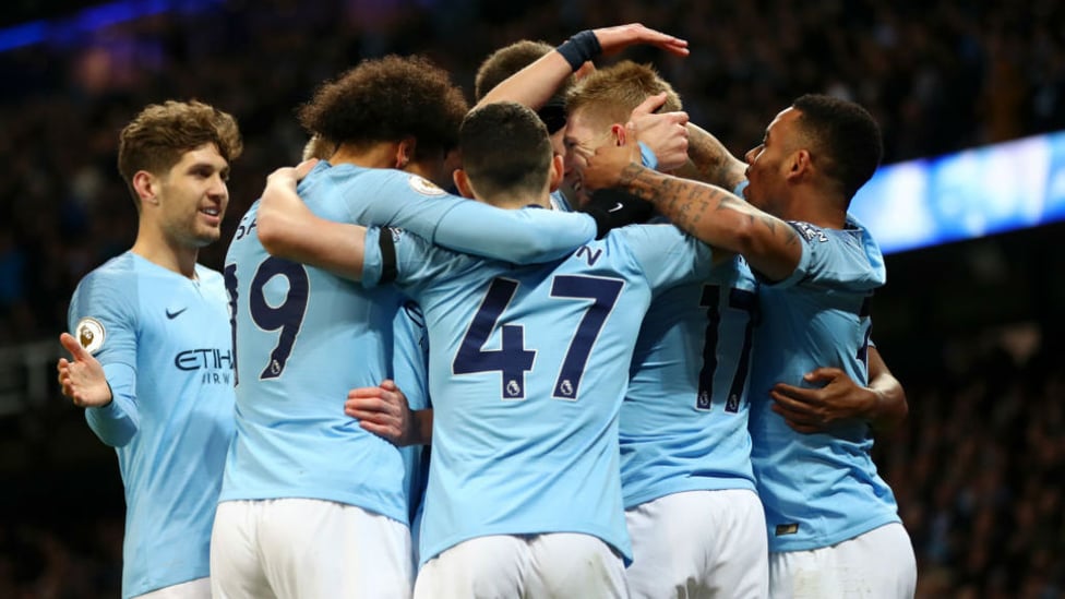 CELEBRATION TIME : Kevin De Briuyne is mobbed by his City team-mates after his incredible opener