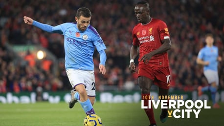 HEAD TO HEAD: Bernardo drives at the Reds' defence after Liverpool took an early lead through Fabinho.