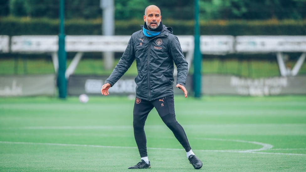 IN CHARGE : Pep Guardiola gets involved with Friday's session.