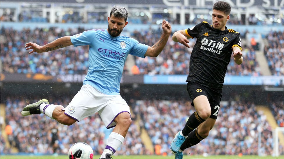 PROBING : Aguero looks to get the better of the Wolves defence.