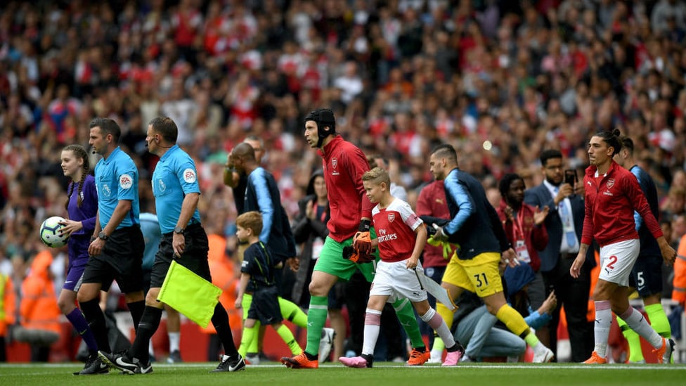 READY FOR ACTION : City and the Gunners walk out onto the Emirates pitch as we prepare to defend our title.