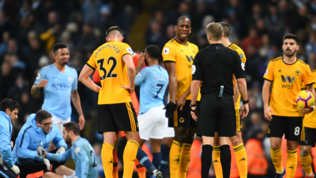 EARLY BATH : Willy Boly sees red for a crunching foul on Bernardo Silva