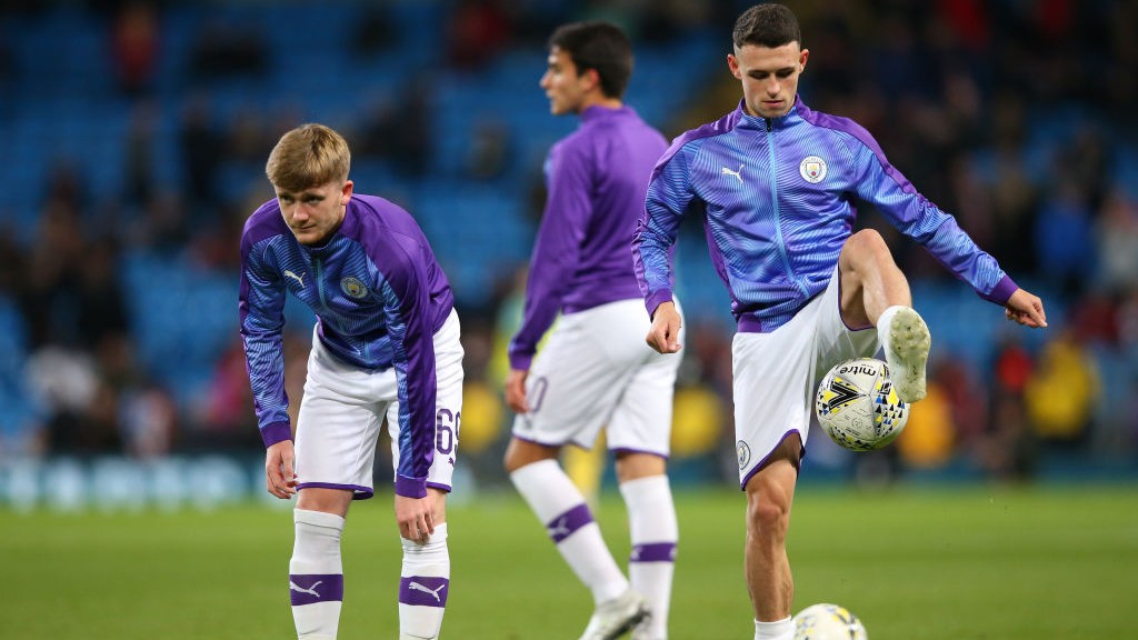 ACADEMY GRADUATES : Tommy Doyle, Phil Foden and Eric Garcia get set in the warm-up.
