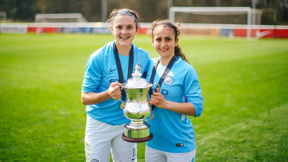 DOUBLE DELIGHT : Katie Bradley and Maria proudly show off the Development League Cup