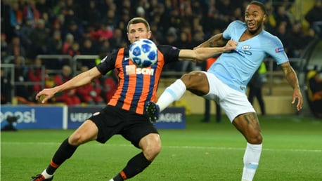 GETTING SHIRTY: Raheem Sterling fends off attention from the Shakhtar defence