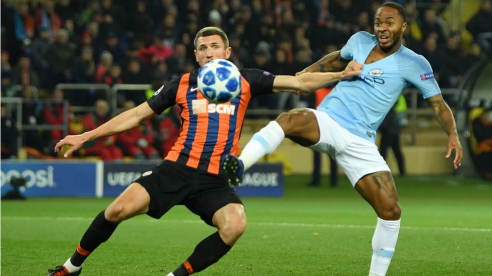 GETTING SHIRTY : Raheem Sterling fends off attention from the Shakhtar defence