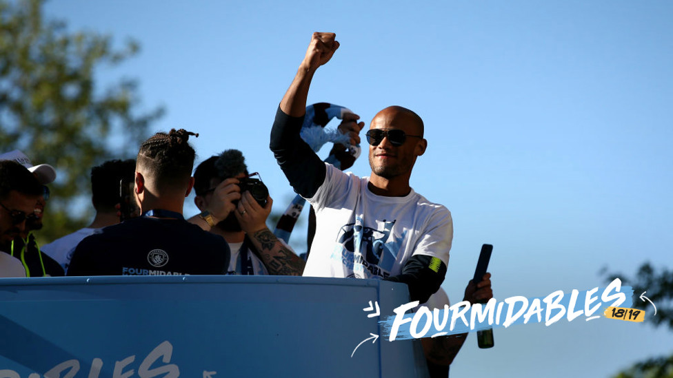 LEADER : Vincent Kompany salutes fans at the champions parade.