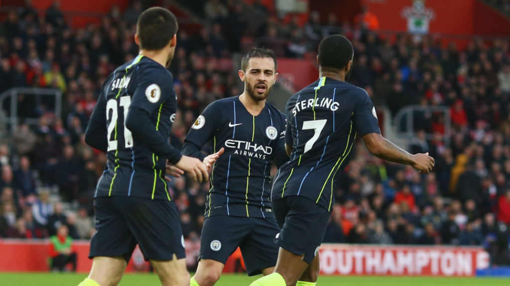 HELPING HAND: Bernardo celebrates with Raheem Sterling after Ward-Prowse's own goal
