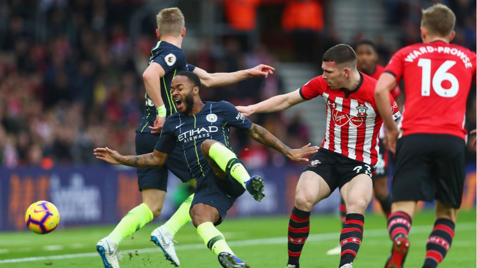 OUCH : Raheem Sterling is sent crashing by Pierre-Emile Hojbjerg