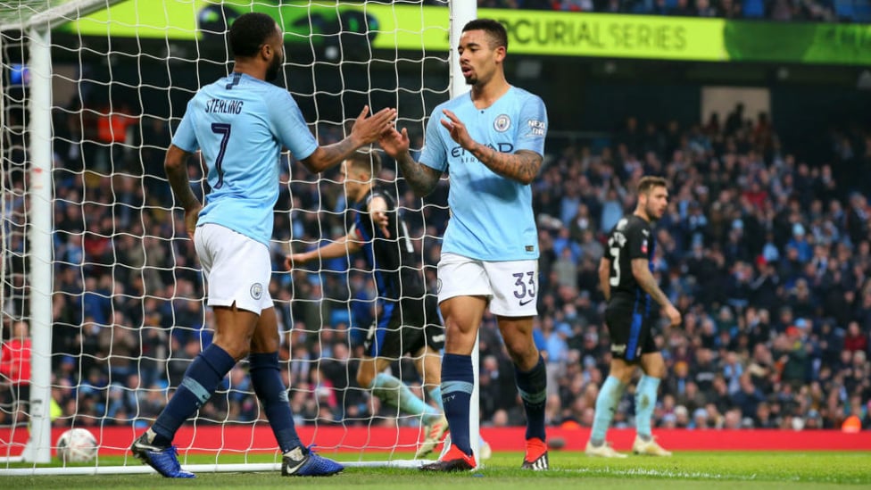 FOUR TOPS : Gabriel Jesus celebrates with Raheem Sterling after tapping home City's fourth goal