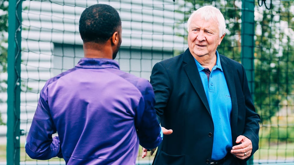 LEGEND : Raheem Sterling greets Mike Summerbee.