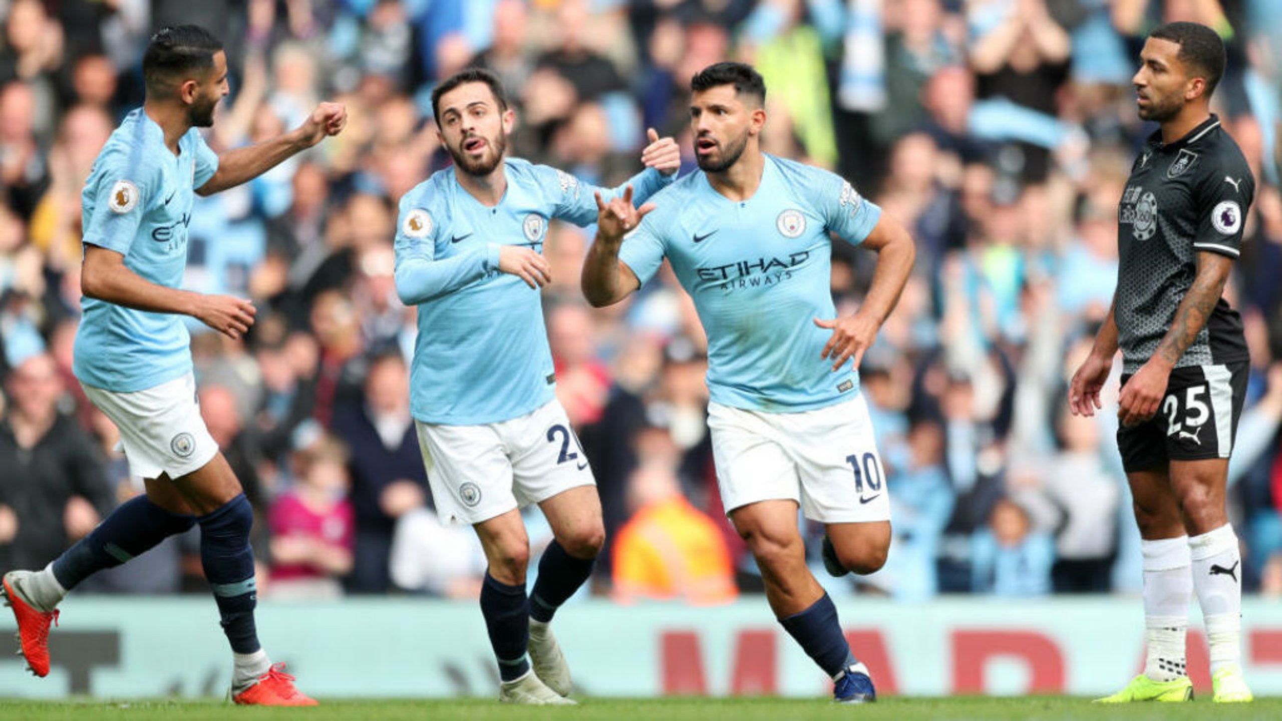 LETHAL WEAPON: Sergio Aguero wheels away in delight after opening the scoring