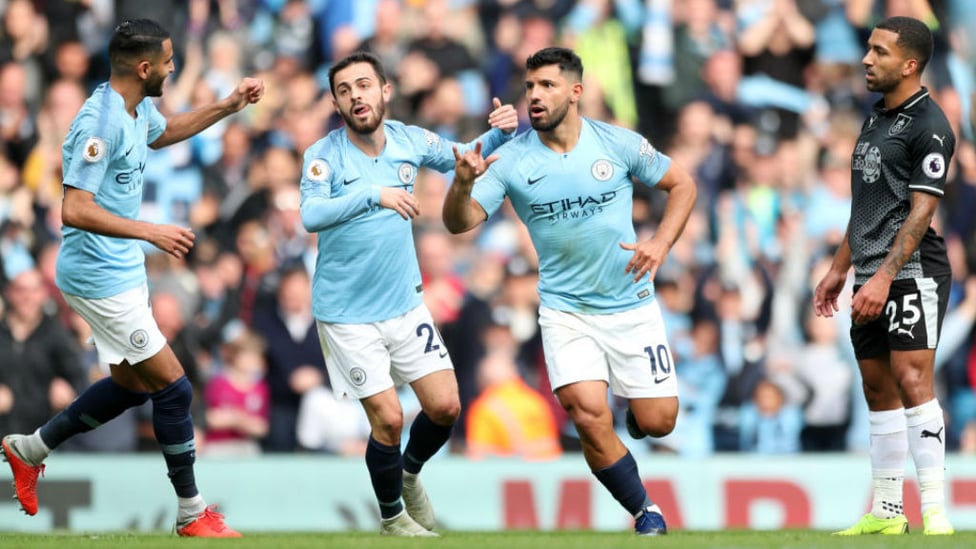 LETHAL WEAPON : Sergio Aguero wheels away in delight after opening the scoring
