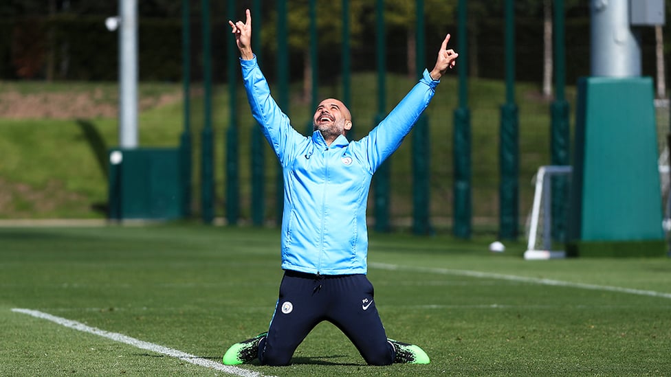 MR BLUE SKY : Manager Pep Guardiola points his arms to the heavens with glee during a breather in today's training session