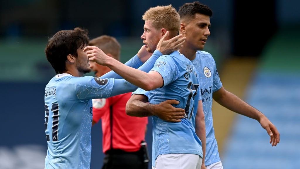 FEELING THE LOVE: Silva and Rodri congratulate KDB after his stunning goal.