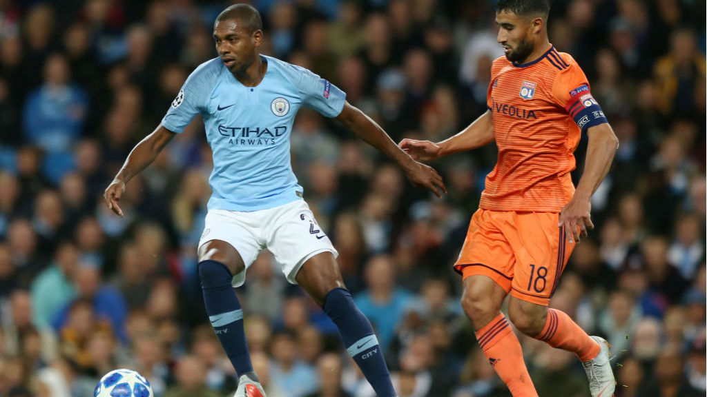 MIDDLE MARCH: Fernandinho takes on Lyon's Nabil Fekir