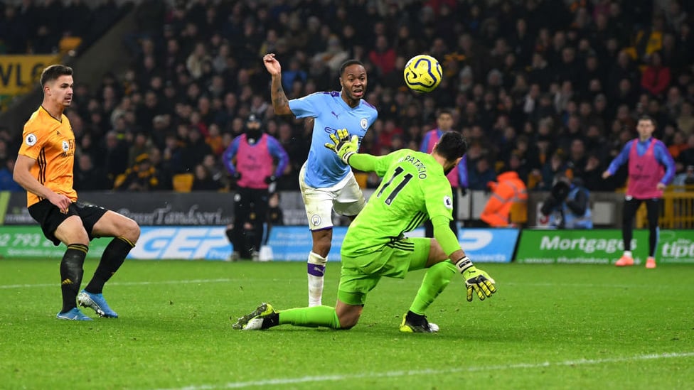 CHEEKY CHIP : Raheem lifts the ball over Rui Patricio