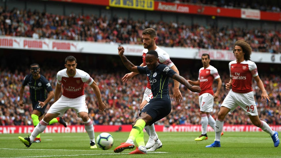 SUNDAY SKILLS : Sterling whips around the Arsenal defence with a goal in his sights.