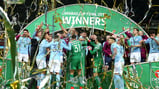WINNERS: City lift the trophy!